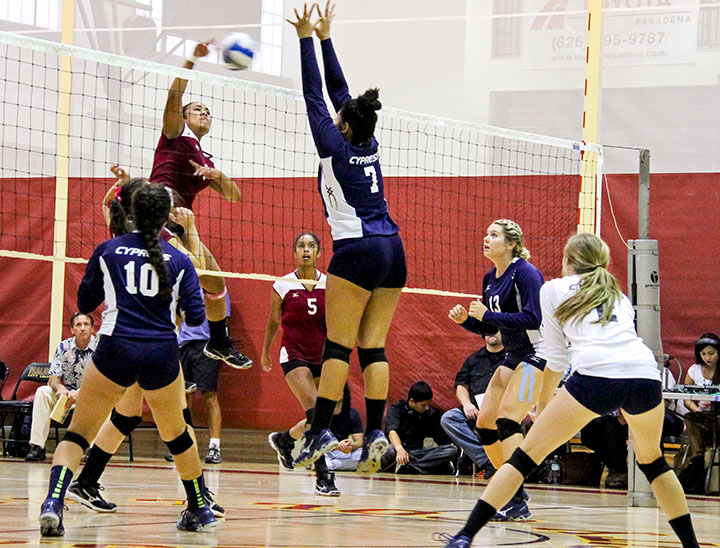 John Novak / Courier Thula Parks spikes the ball during Volleyball's game against Cypress on Wednesday, Sept. 18, 2013. They won 3-2.