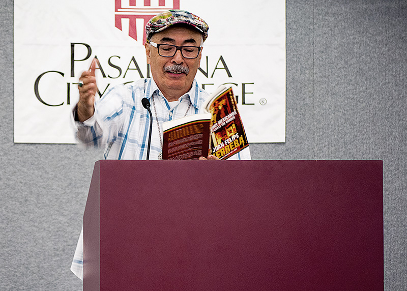 Concepcion Gonzalez / Courier Poet Juan Felipe Herrera reads to audience poetry from his book, "187 Reasons Mexicanos Can't Cross the Border" in the Creveling Lounge on Mar. 19.