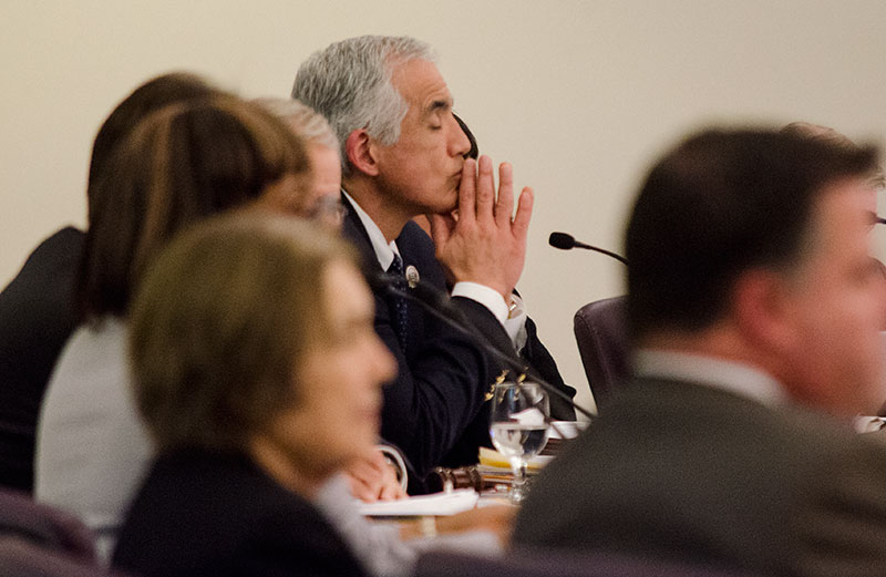 Antonio Gandara / Courier President Mark Rocha listens intently to the comments made about his administration at the Board of Trustees meeting on Wednesday, Mar. 13.