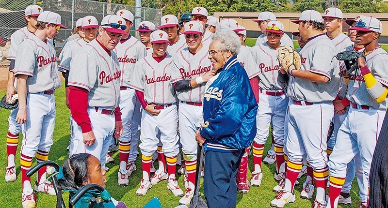 Ronald Johnson / Courier Delano Robinson, (wife of Jackie Robinson's brother Mack), chats with PCC Baseball HeadCoach (front L) and players after pre-game ceremony honoring Jackie Robinson and dedicating the jersey and the famed number 42 while playing at then Pasadena Junior College, on Tuesday, February 28, 2012. Brittni Hamleton (front center), grand daughter of Delano Robinson looks on.