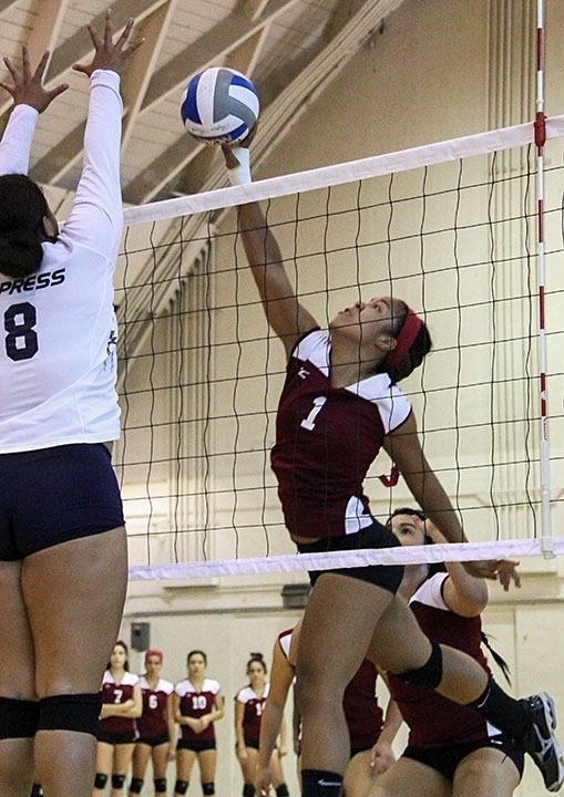 Teresa Mendoza / Courier PCC's outside hitter Thula Parks (1) tries to spike past the defense of Cypress' Kiki Atuatasi during El Camino Quad Tournament on Friday, Sep. 13, 2013 at El Camino College, Torrance, CA. PCC won the first set 25-22 but lost the subsequents four sets 25-23, 25-21, 25-22.