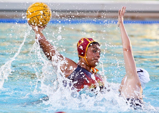 Scarlett Bonilla shoots and scores at home in the Aquatics Center against East Los Angeles College on Sept 18, 2013. In the second game of a double header the women’s water polo team lost a tight game 10-9. (Courier/Benjamin Simpson)