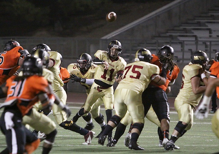 PCC quarterback Darrian Cazarin throws a forward pass during the homecoming game against the Ventura Pirates at home in Robinson Field on Saturday Nov 9, 2013. The Lancers lost the game 37-27 and are now 1-8 for the season. (Courier/Benjamin Simpson)