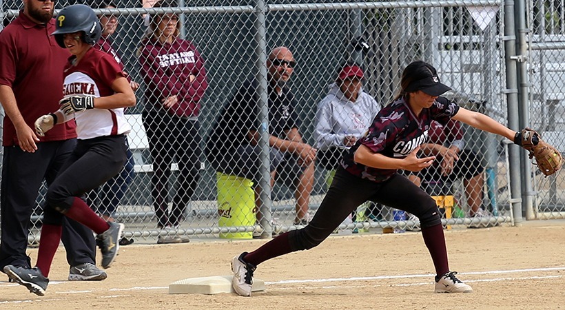 Shortstop Anais Sustayta throws to third baseman Alejandra Grimaldo for the third out of the seventh inning, April 21, 2015. The Lancers' defense held ECC Compton to two runs until the sixth inning. (Max Zeronian/Courier)